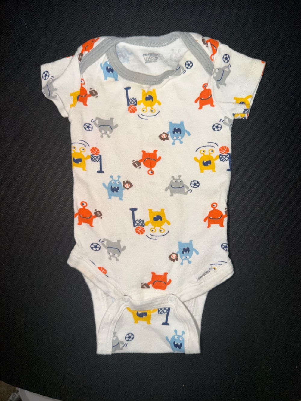 ONESIE BRAND Kids White One-Piece with Red, Yellow, Blue, Gray Monster Print